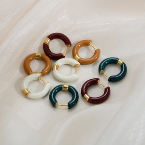 Detailed set of enamel hoop earrings in burgundy, caramel, cream, and dark green colors