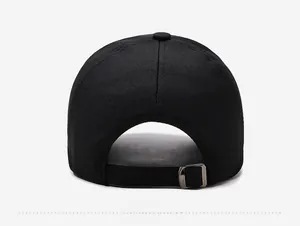 Detail of black baseball cap back view featuring adjustable metal buckle and cotton twill