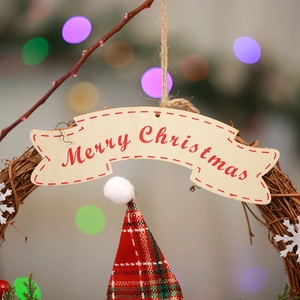 Detailed close-up of a rustic rattan Christmas wreath with red plaid fabric and pine needles