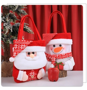 Detailed view of Santa and Snowman knitted Christmas gift bags with snowflake patterns