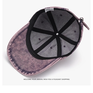 Internal view of purple-pink washed denim baseball cap with sweatband and metal buckle