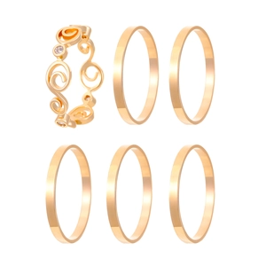 Detail of 6-piece vintage gold ring set featuring star moon motifs and smooth bands