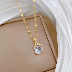 Macro view of gold-plated square zircon pendant on a luxury banquet necklace