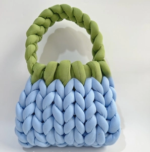 Detail of DIY chunky knit bag showing green and blue hand-woven ice island yarn textures