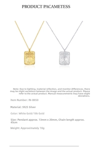 Macro detail of S925 sterling silver rectangular textured pendants in gold and silver