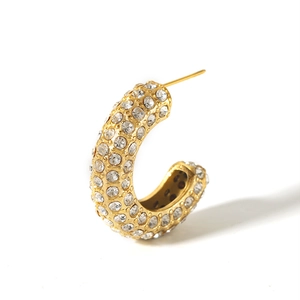 Detailed view of C-shaped 18K gold-plated earring with pavé-set shimmering crystals