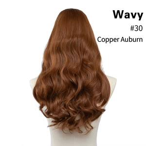 Detail view of wavy long synthetic hair extensions in #30 copper auburn on a model