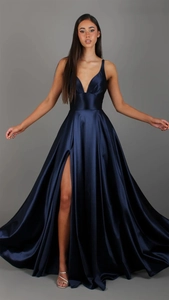 Detailed close-up of dark blue silk satin dress fabric with high side slit and smooth texture