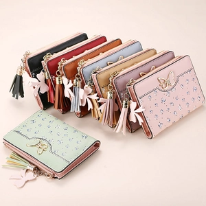Short PU leather wallet for women with floral print, butterfly buckle and tassel fringe