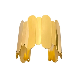 Polished gold wide cuff bracelet featuring a unique geometric wavy pattern edge