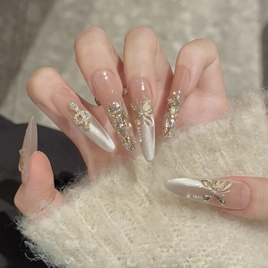 Handmade almond press-on nails with cat-eye effect, gold butterflies and pearls