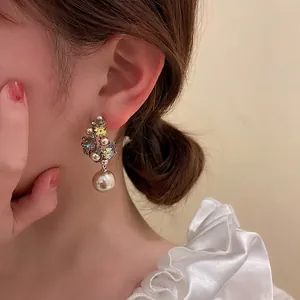 Elegant floral drop earrings with yellow crystals and white pearls for women