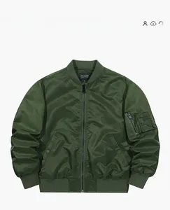 Detail of army green bomber jacket with ribbed collar and classic arm zipper pocket
