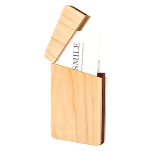 Detail view of walnut wood business card holder with two-tone finish and laser engraving