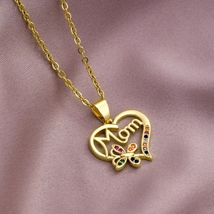 Close-up of gold Mom heart pendant with colorful cubic zirconia butterfly detail