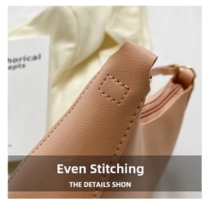 Close-up of beige lychee grain leather handbag with professional uniform stitching