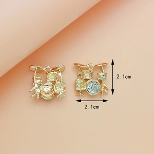 Golden drum set musical instrument pendant with rhinestones measuring 2.1cm size