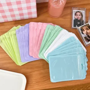 Pastel macaron color ziplock bags in six shades on a table for photocard storage