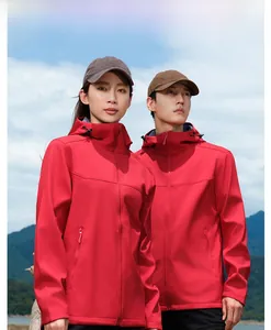 Outdoor couple wearing red hooded softshell jackets with windproof and waterproof fabric