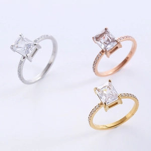 Three elegant vintage square-cut diamond rings in silver, gold, and rose gold finishes
