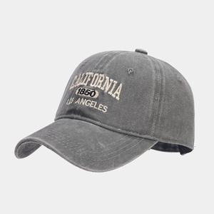 Detail of vintage gray washed cotton baseball cap with retro California 3D embroidery