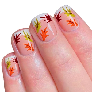 Short square French nails with autumn maple leaf patterns on soft pink base