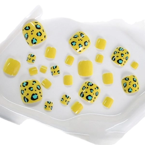 Short square press-on toenails featuring yellow and cyan leopard print patterns