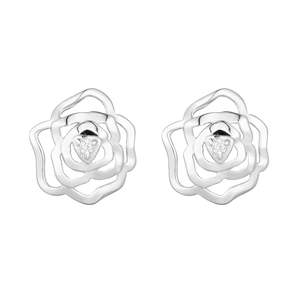 Detail of silver rose stud earrings with a sparkling zircon center on a white background
