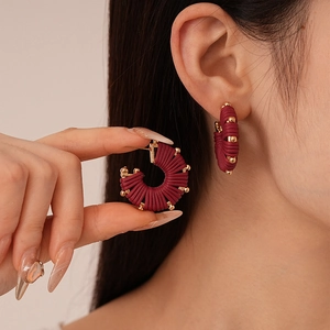 Vintage style burgundy woven leather C-shaped stud earrings with gold bead detail