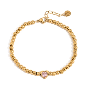 Close-up of gold beaded bracelet featuring pink heart zircon and S.STEEL hallmark