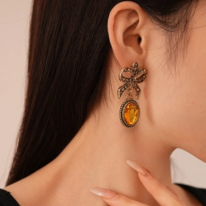 Vintage gold bow earrings with brown crystals and amber oval gemstone for women
