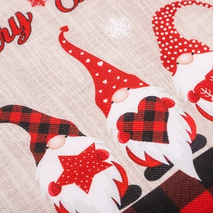Christmas gnome placemat with red black plaid pattern on festive linen fabric