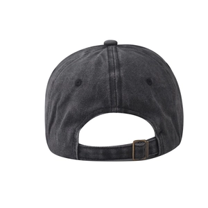Detail of washed cotton baseball cap featuring adjustable bronze metal buckle at back