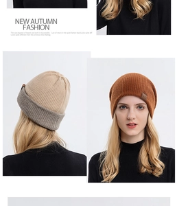 Close-up of beige and orange knitted beanie showing premium textured wool and stitching