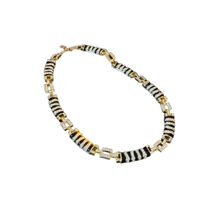 Elegant gold metal and black chain link necklace with sparkling rhinestone accents
