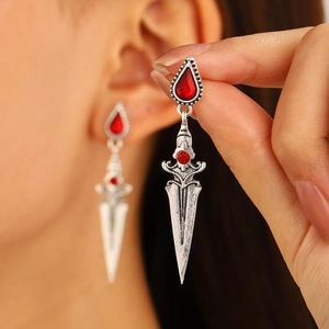 Gothic sword earrings with red pear-shaped gemstones in antique silver finish