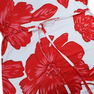 Detailed close-up of the adjustable waist tie on a white floral print summer maxi dress
