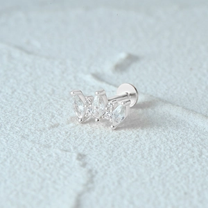Detailed shot of S925 sterling silver moon cartilage stud with marquise-cut gems