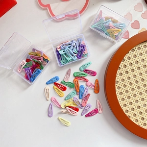 30 pack of colorful candy-colored metal snap clips for kids with clear storage cases