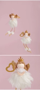 Detail view of plush Christmas angel ornaments with gold wings and sequin crowns