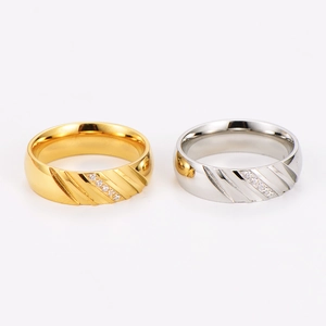 Striped stainless steel ring with pavé rhinestones in gold and silver finish