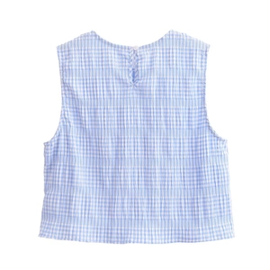 Detail of blue plaid sleeveless top back featuring a single button closure and textured fabric