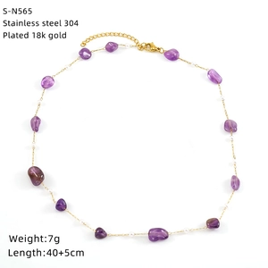 Close-up of 18k gold plated stainless steel necklace with purple crystals and pearls