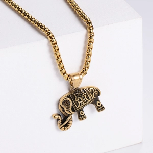 Vintage golden African elephant pendant necklace with floral engravings on round box chain