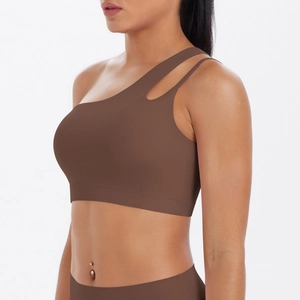 Detail of mocha brown one-shoulder sports bra with cutout and side strap design