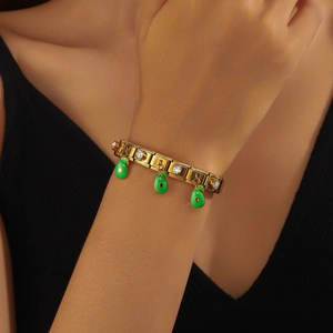 Gold Italian charm bracelet with green enamel avocado pendants and sparkling crystals