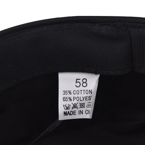 Detail of internal care label showing 58 size and fabric blend on black military cap