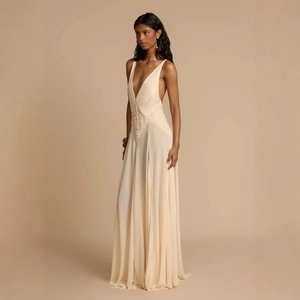 Elegant ivory backless maxi dress with deep V-neck and lace cutout stitching