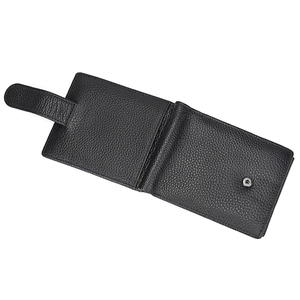 Detail of genuine black lychee leather wallet interior showing metal snap button and texture