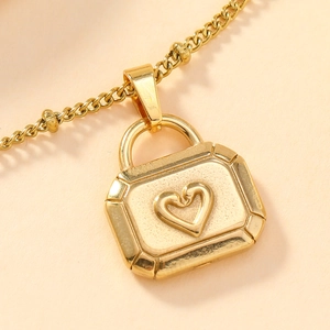 Golden necklace featuring a rectangular locket pendant with an embossed heart pattern
